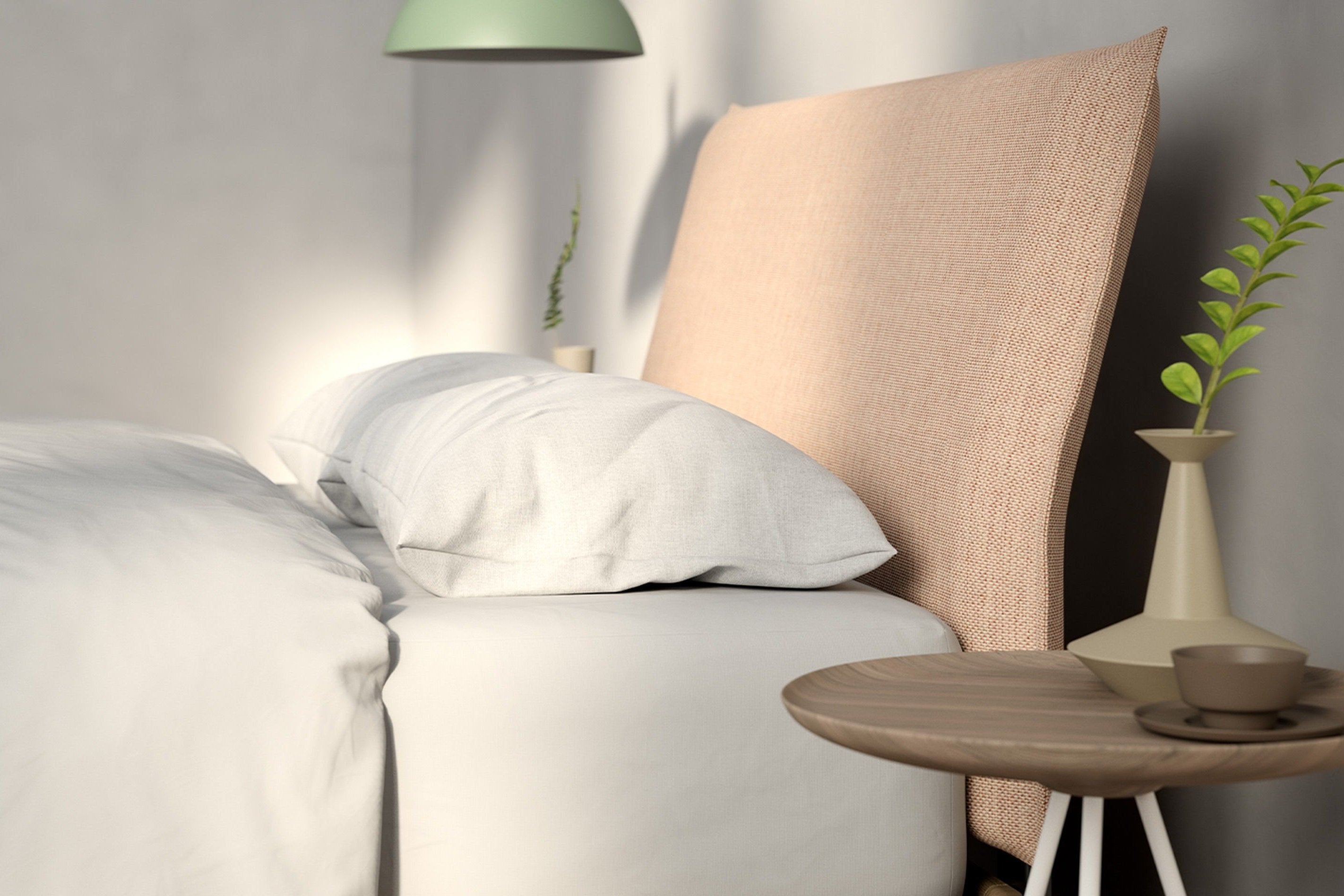 Side view of the head of a fully made bed with a headboard.