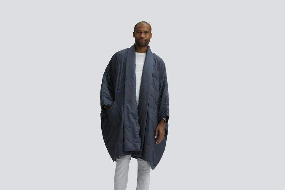 A person wearing the Snoozewear Blanket Robe, indigo