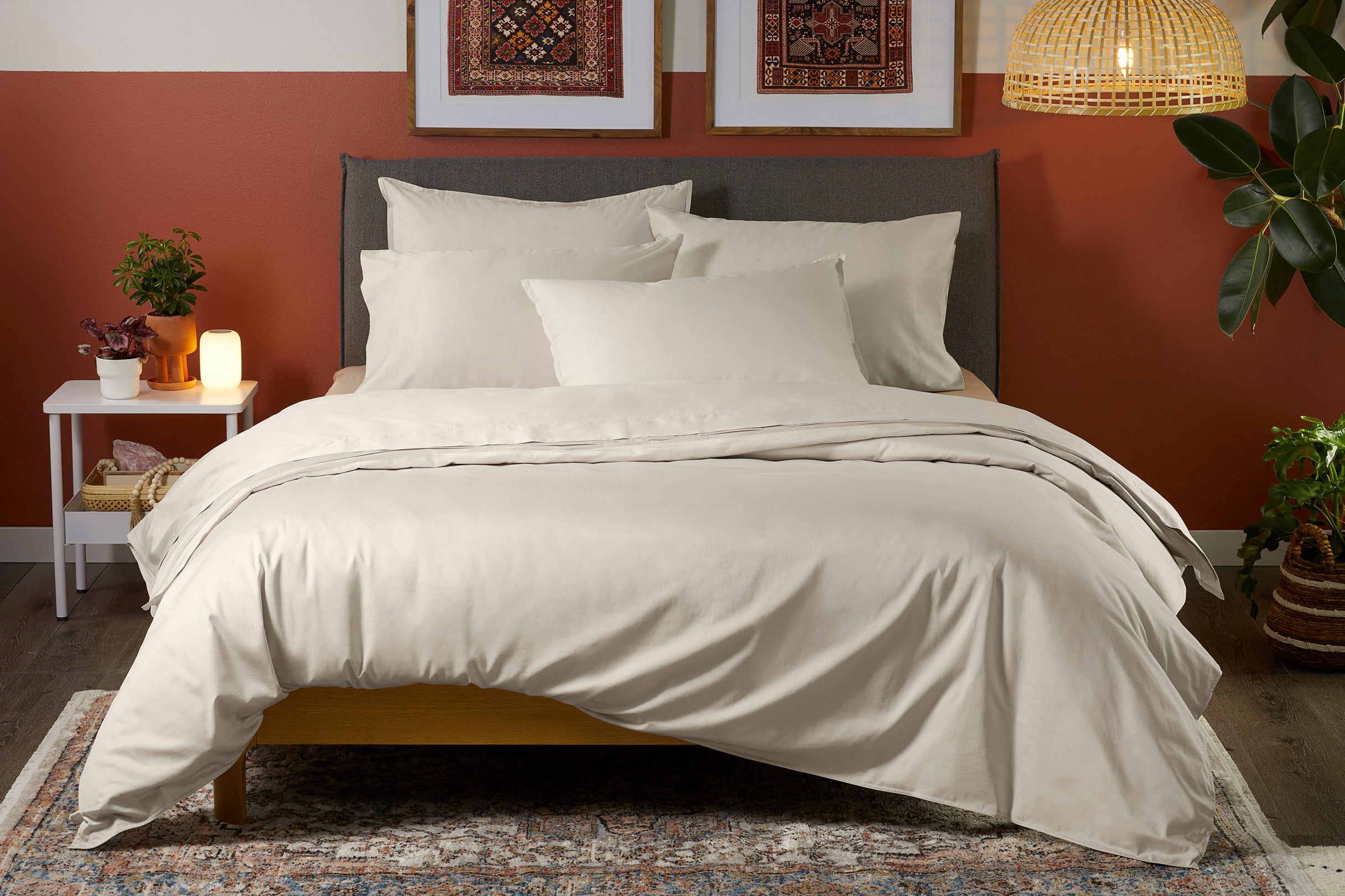 Front-facing view of bed made with Sateen Sheet Set, oatmilk color