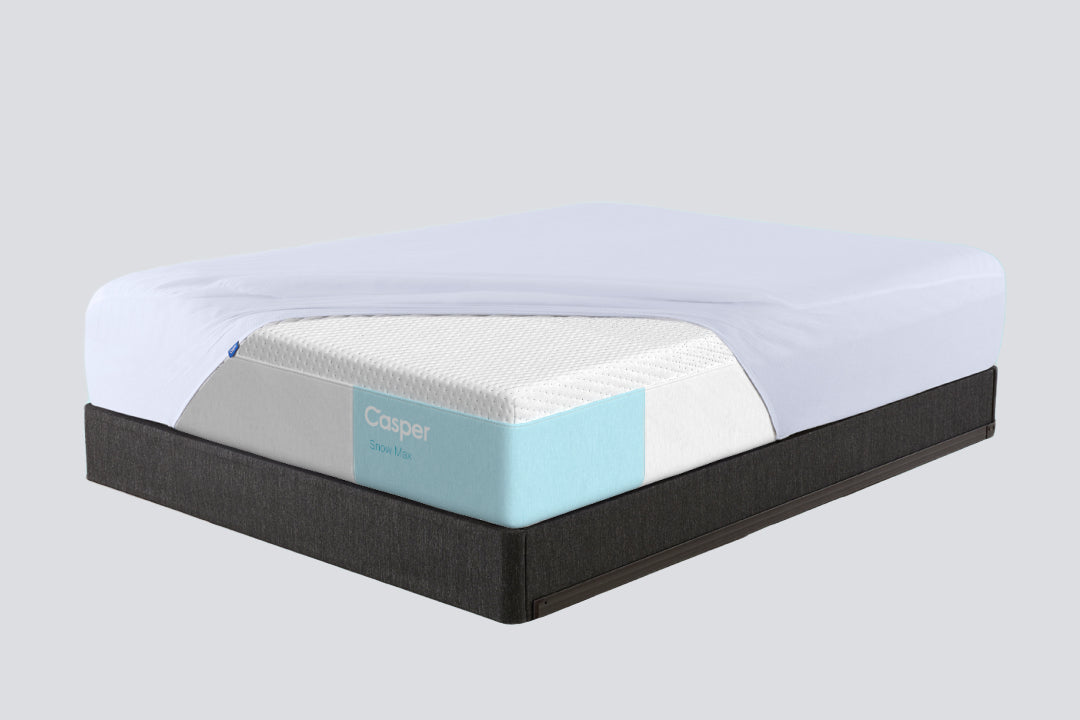 mattress protector on a Casper Snow Max mattress on a Foundation base