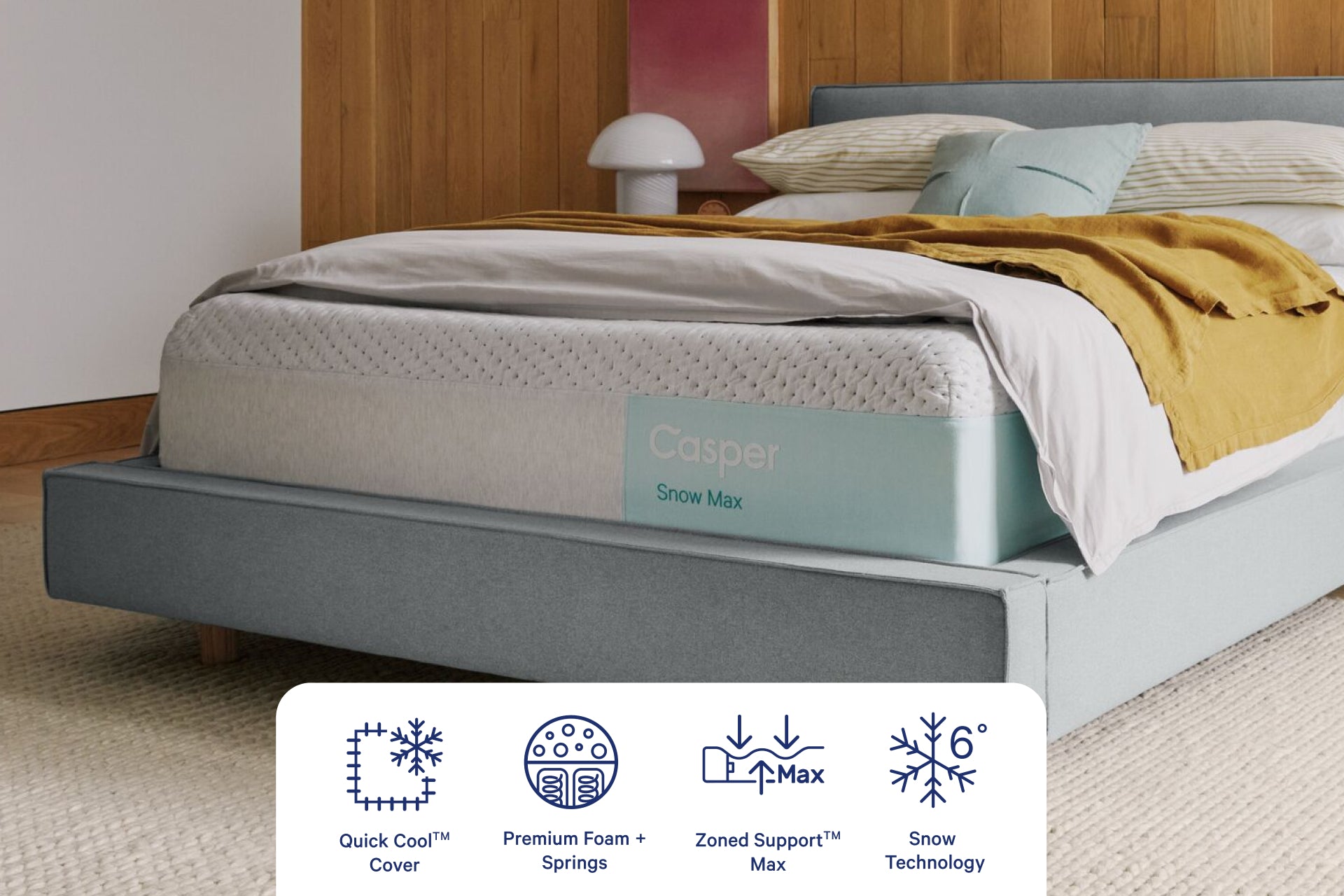 Corner view of Casper's Snow Max Mattress. Graphics at the bottom of the image indicate features including QuickCool™ Cover, Premium Foam and Springs, Zoned Support™ Max, and Snow Technology.