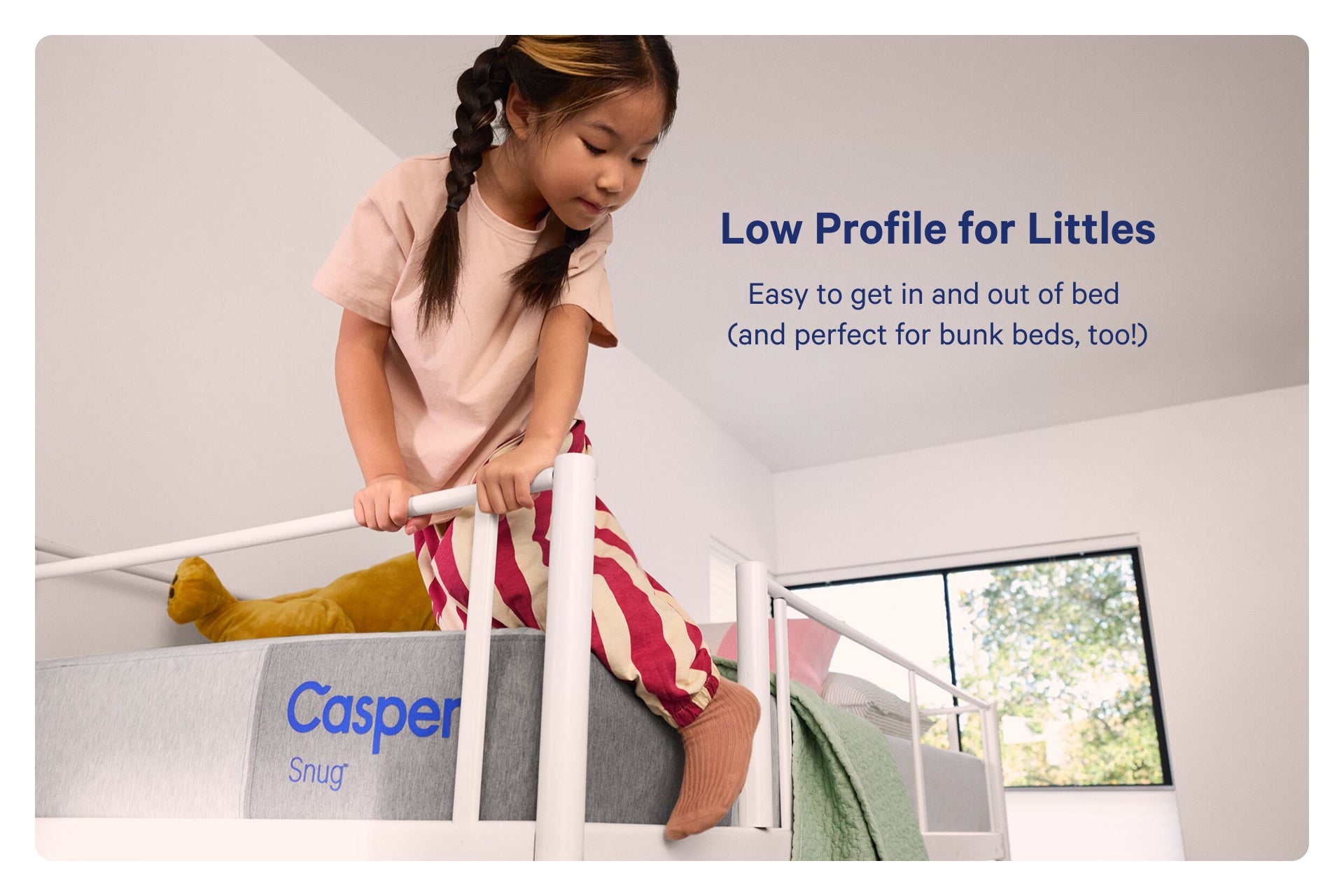 Child getting into a Casper bed with text about its low profile design. Low profile for littles. Easy to get in and out of bed (and perfect for bunk beds, too!).