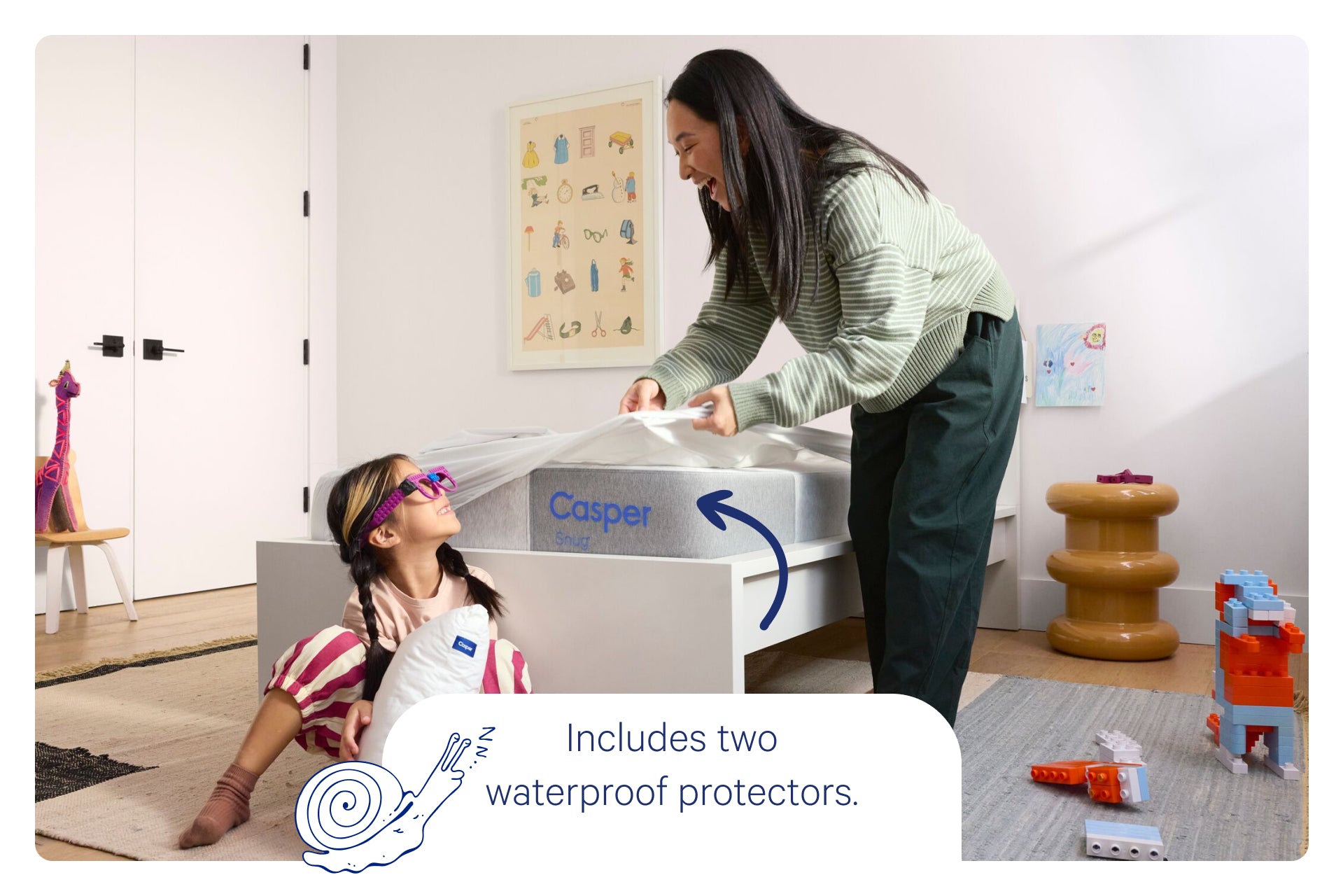 Woman and child playing with a Casper product in a room with toys and furniture. Text on the image reads, "Includes two waterproof protectors."