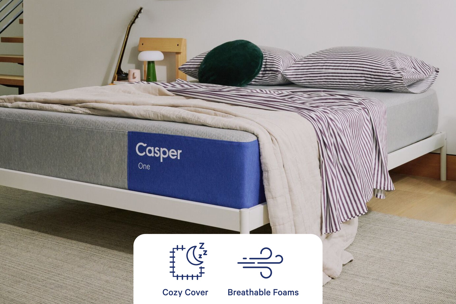 Casper's The One mattress. Corner view. A graphic on the image shows that it has a cozy cover and breathable foam layers.
