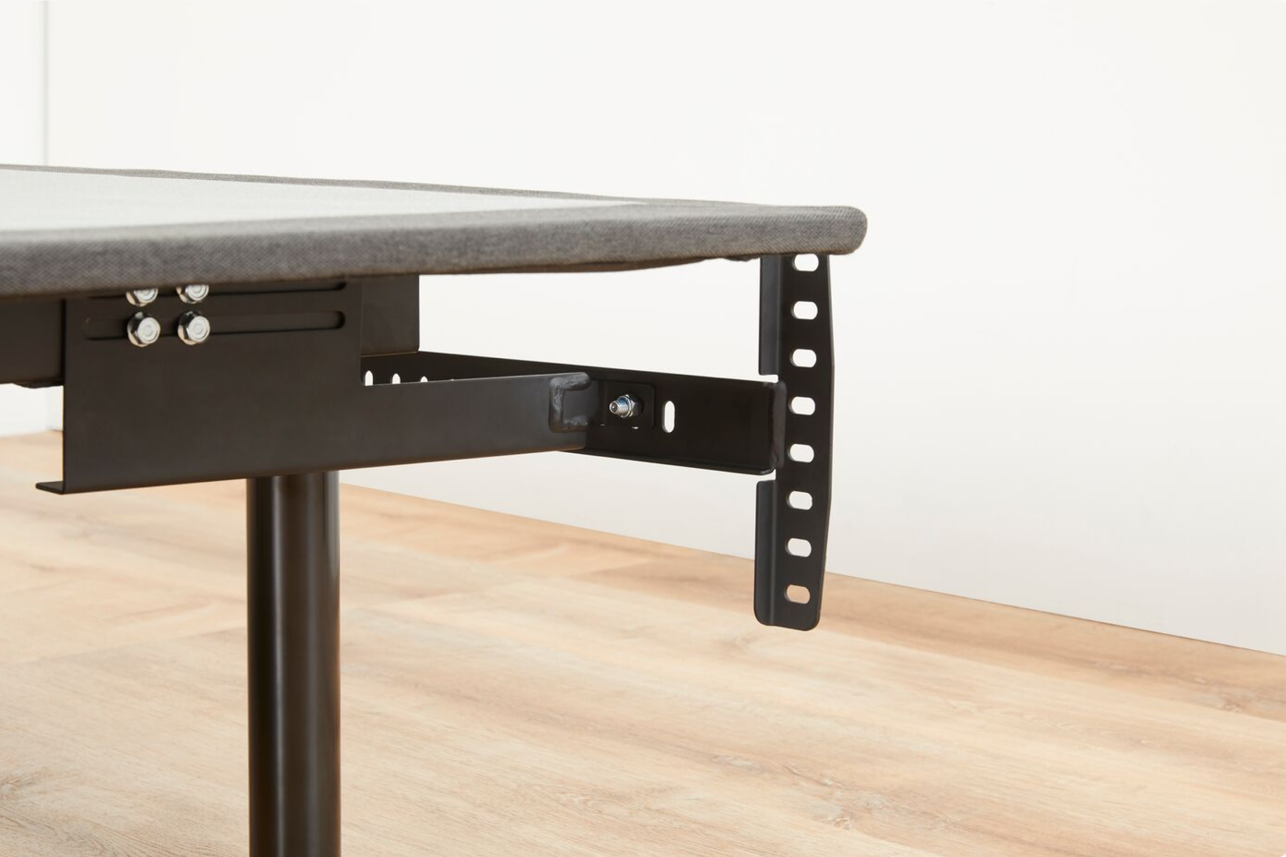 Close-up of the Headboard Bracket attached to a bed frame
