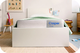 Casper Snug mattress in a child's bedroom with toys and furniture around