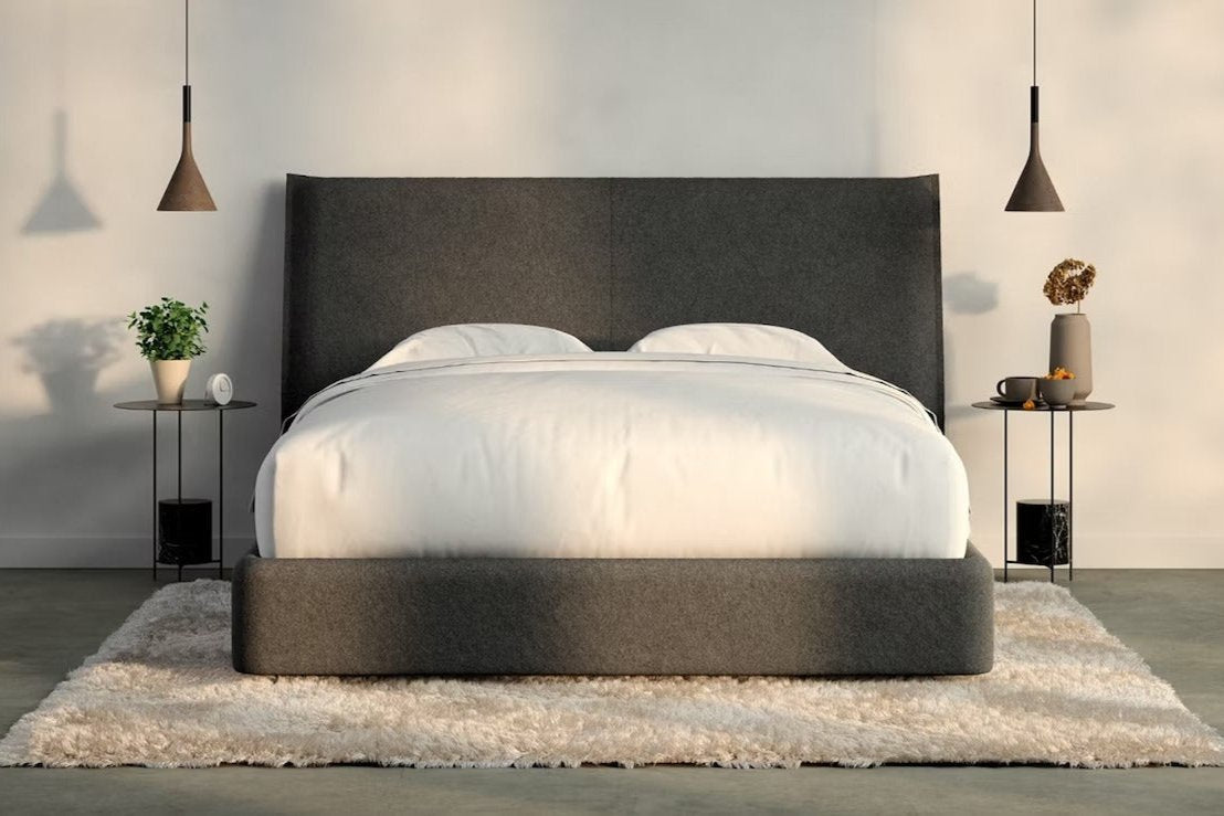 A fully made bed with a Haven Bed Frame and headboard. Front view.