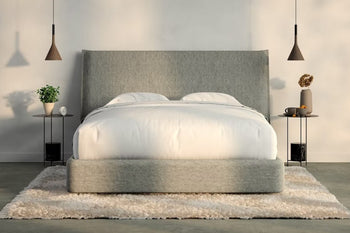 A fully made bed with a Haven Bed Frame and headboard. Front view.