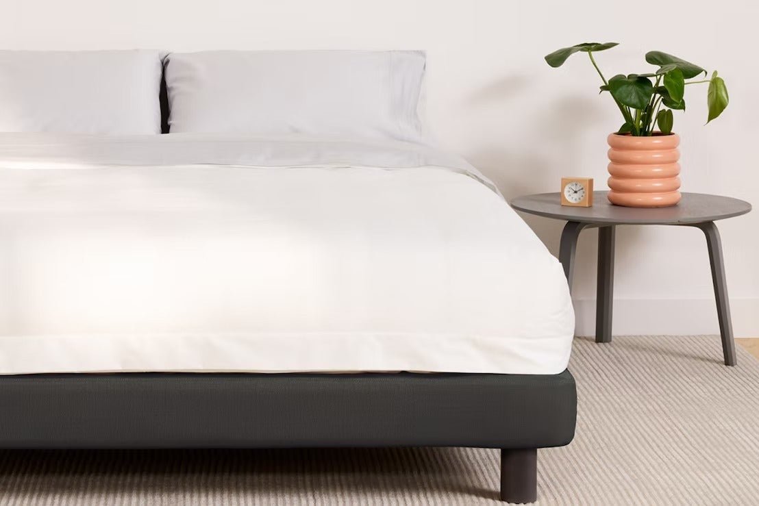 Casper's Upholstered Bed Frame, part of a fully made bed setup in a bedroom.