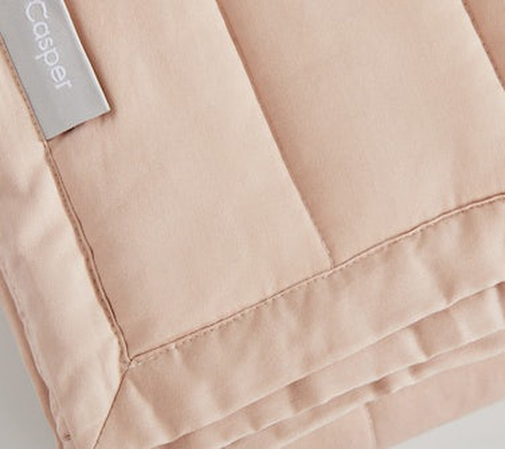 Close-up of Weighted Blanket, dusty rose, folded